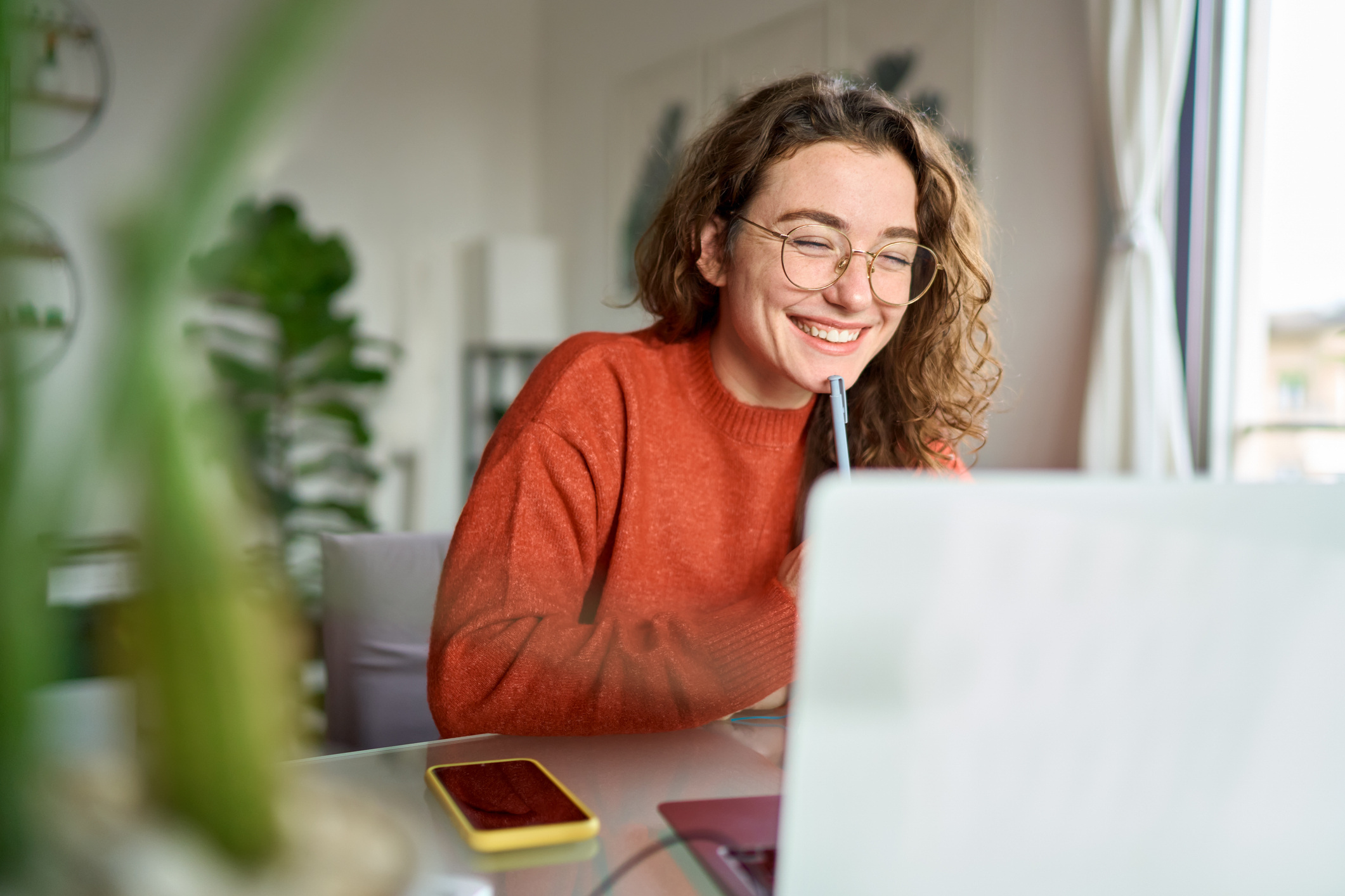 woman smiling while working remotely